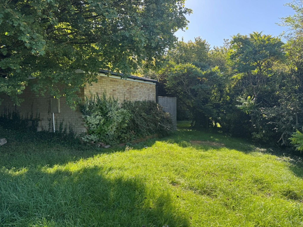 Lot: 47 - APPROXIMATELY HALF AN ACRE OF LAND WITH VACANT POSSESSION - View of garage and decking area